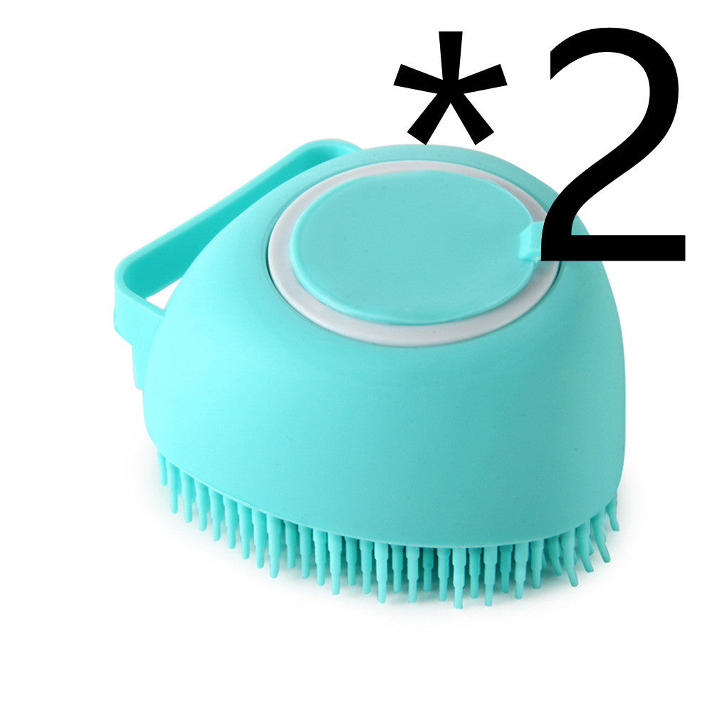 Dog and cat bath brush that removes loose hair during grooming.