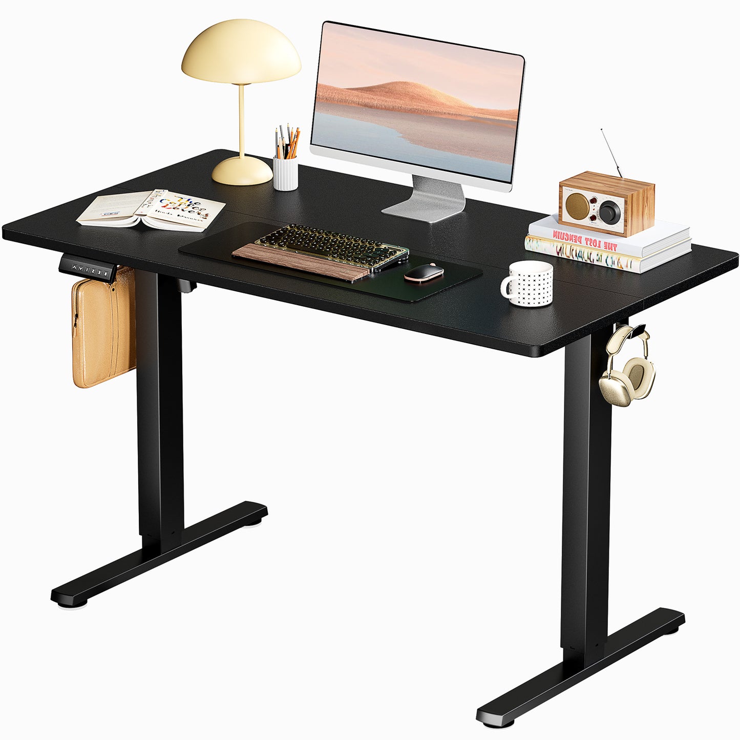 Compact height adjustable computer desk for small spaces.