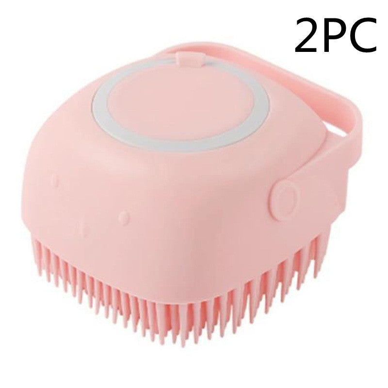 Pet grooming brush with soap dispenser for home bath use.