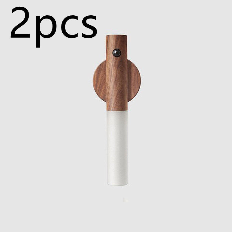 Wireless magnetic night lamp with wooden finish.