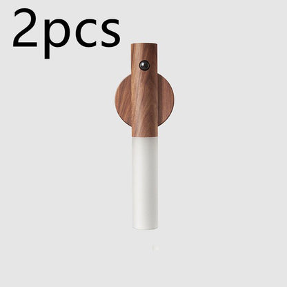 Wireless magnetic night lamp with wooden finish.